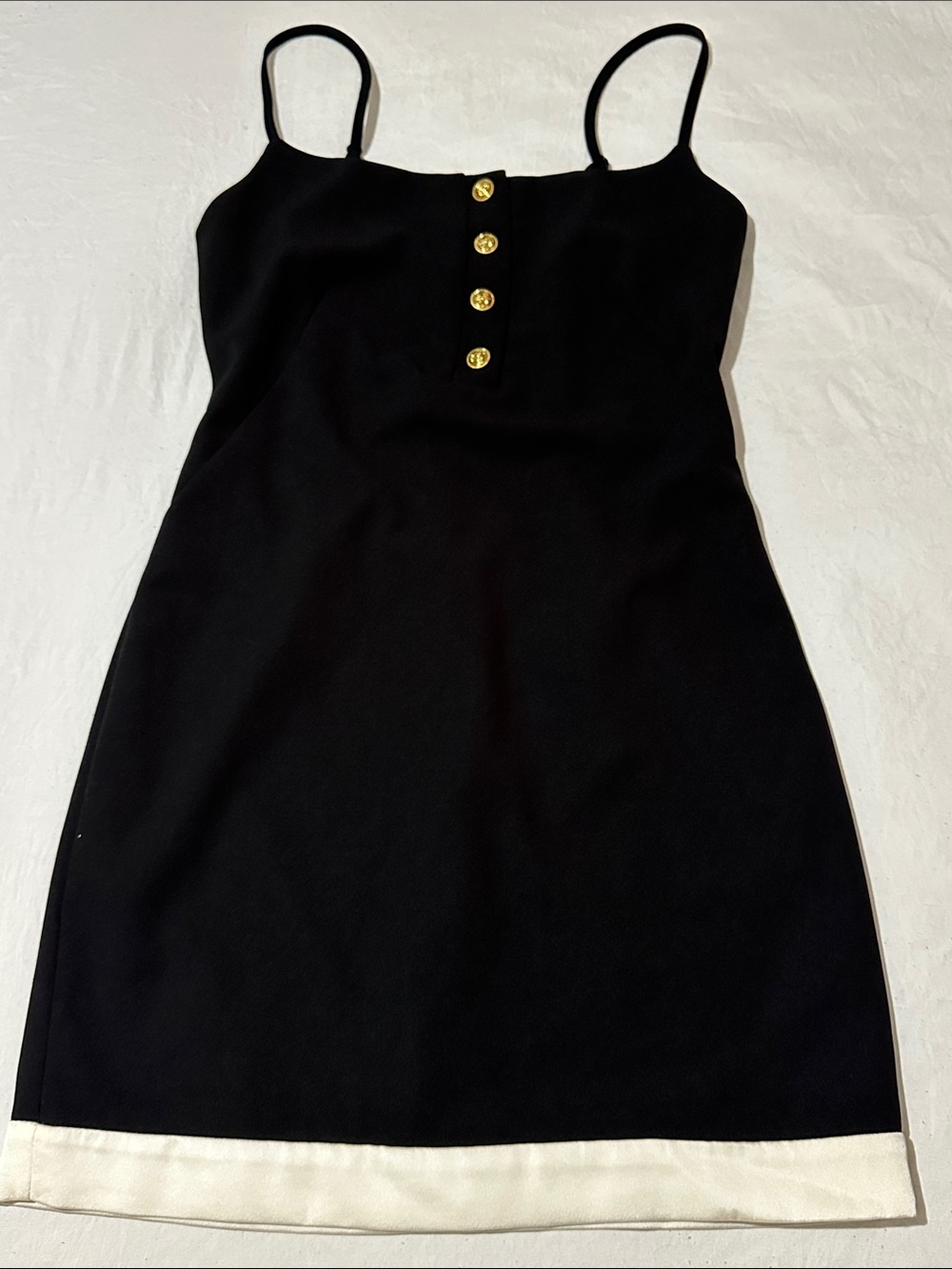 Gill Judith Elegant Black Mini Dress with White Hem and Gold Button Detail